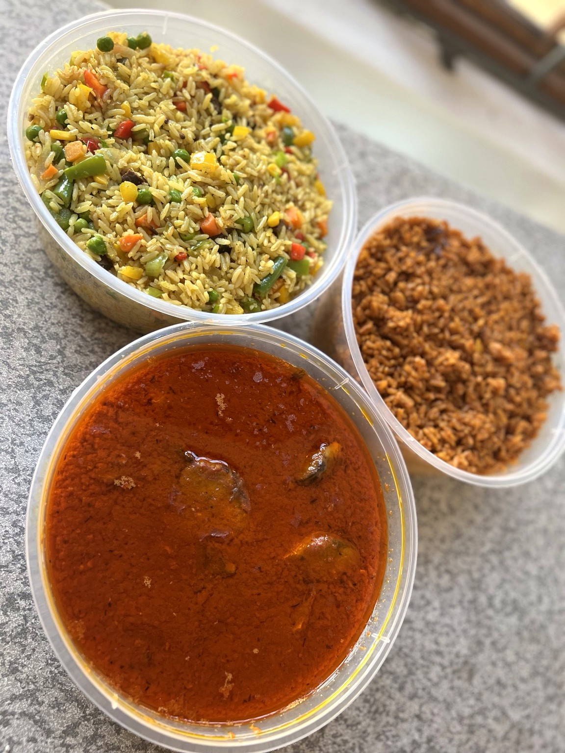 A selection of BETA JOLLOF rice and stew dishes